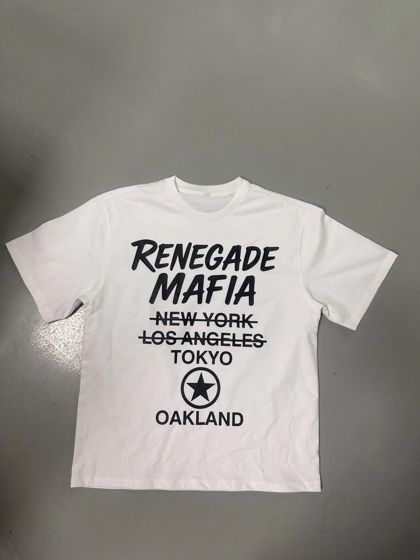 White Renegade Mafia Oakland streetwear t-shirt with Tokyo, NY, and LA crossed out – bold graphic tee designed in the Bay Area