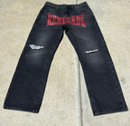 Front jeans flat lay:
“Black denim jeans with bold red ‘RENEGADE’ print across the front and distressed thighs by Renegade Mafia”
